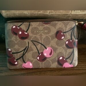Coach Wristlet In Tan Signature Canvas With Cherry Print